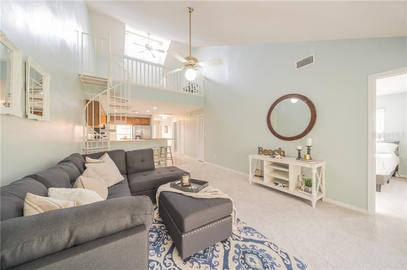 Family room open to kitchen, second floor loft and master suite through doorway on the right