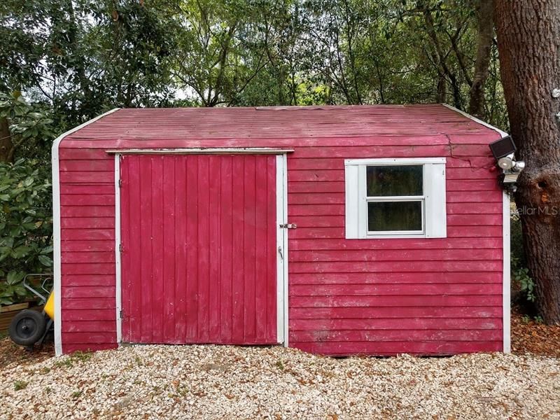 Shed With Power Provides Storage For The Lawn And Garden Equipment!