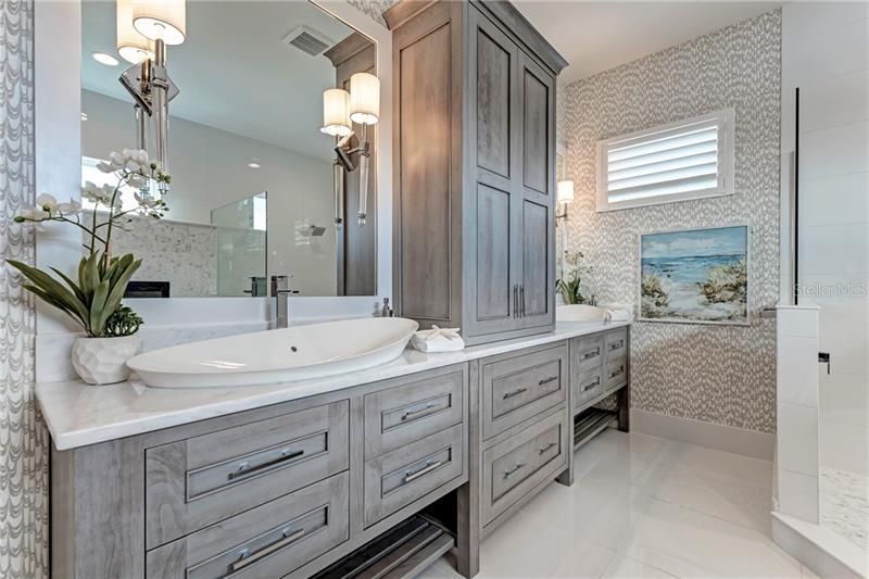 Dual sinks and custom cabinetry in Owner's Suite