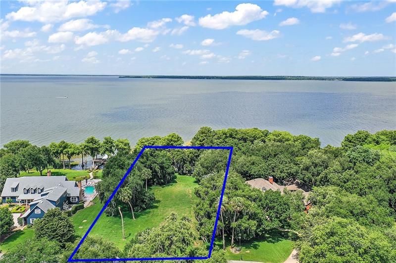 Lot 17 at The Peninsula on Lake Harris, blue lines indicate approximate lot boundaries. Survey is available.