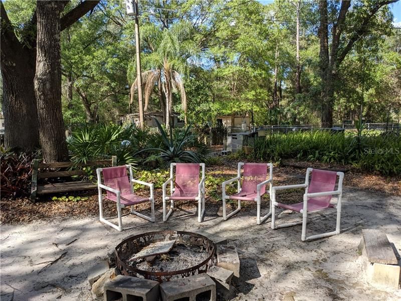 Enjoy sitting by the fire in your private oasis in the Ocala National Forest.