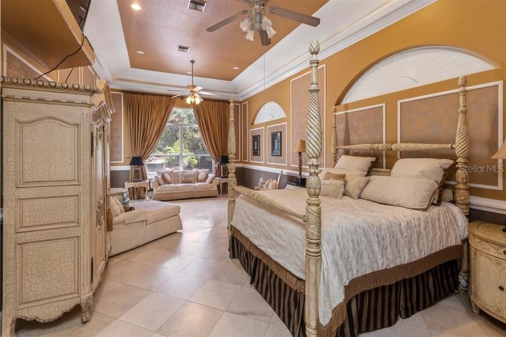 Master Suite, marble floors, sitting area, tray ceiling & custom wall design