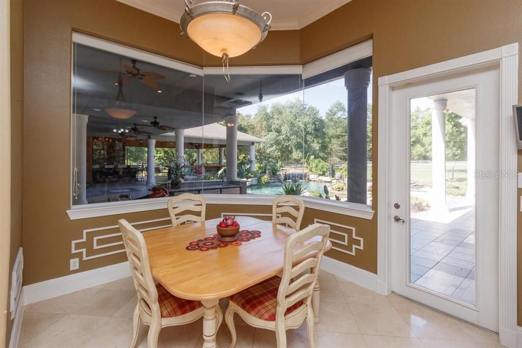 Breakfast/Luncheon Room with relaxing view of pool & waterfalls