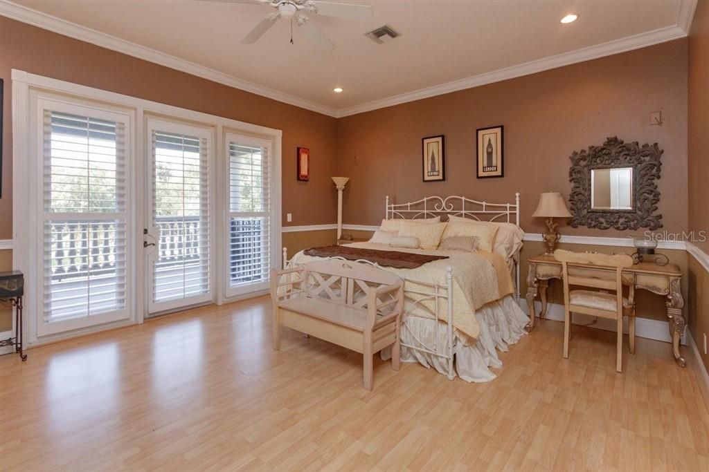 2nd floor bedroom with access to an outside veranda