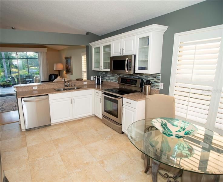 Kitchen overlooking family room and lanai.