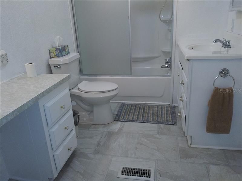 2nd bath has been updated with new shower/tub, new fixtures, and commode