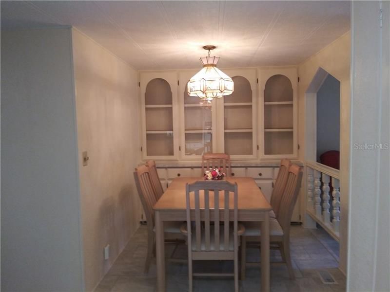 Separate dining area with built in cabinets, more storage!