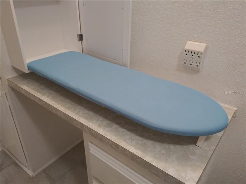 Surprise, it's a built in ironing board.  How convenient is that?