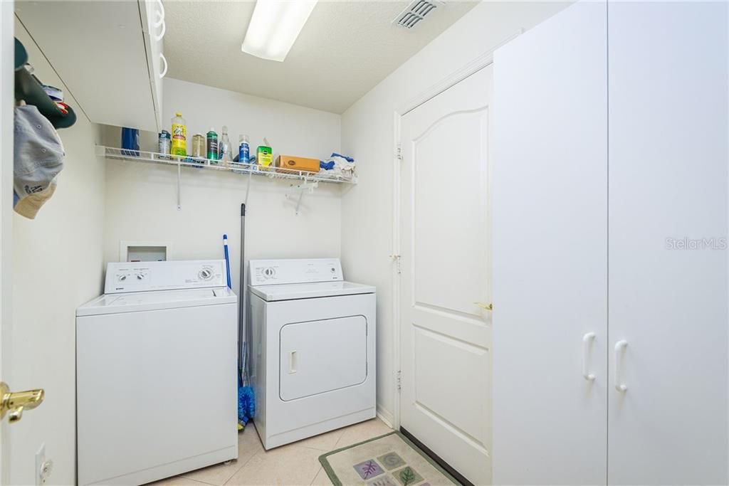 INSIDE LAUNDRY, WASHER & DRYER INCLUDED, STORAGE CABINETS, SHELF AND STORAGE CLOSET.