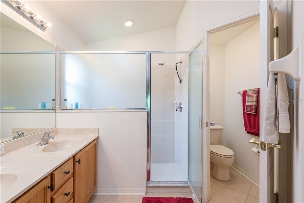 MASTER BATH, DUAL SINKS, TILED SHOWER, PRIVATE RESTROOM.