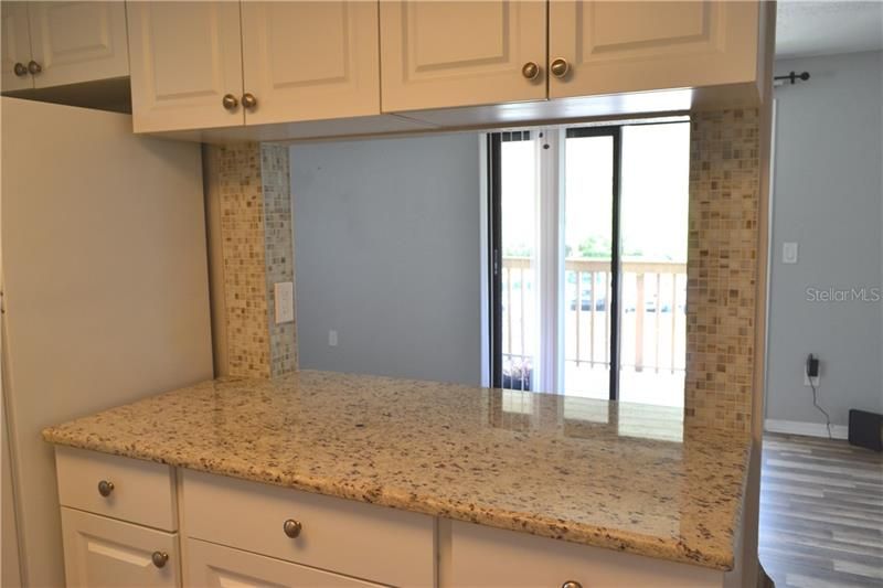 Granite counters! Breakfast area with nice view to balcony!