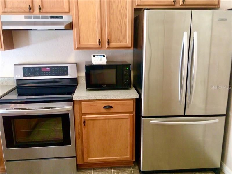 Updated appliances and wood cabinets