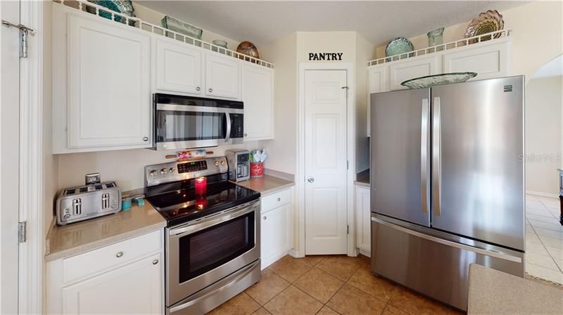 Kitchen with 2 corner pantries, newer appliances and tile floors
