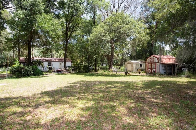 The property is a full acre and has storage sheds and lots of room to roam!