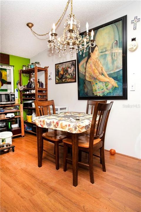 Dining area is open to the kitchen and great room.  Chandelier does not convey