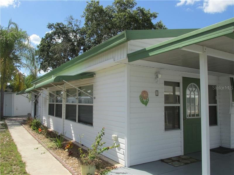 Home has awnings to keep the house cool and for protection from the weather.