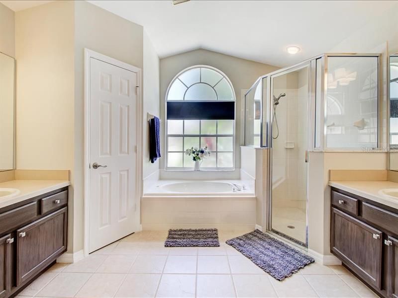 MASTER BATHROOM WITH HIS & HER SINKS, SOAKING TUB AND WALK IN SHOWER