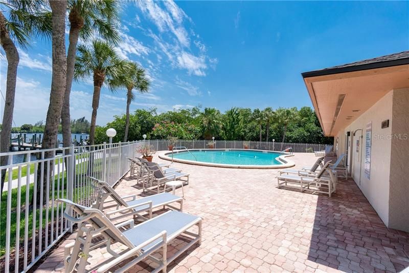 Community pool with exceptional deck space for lounging.