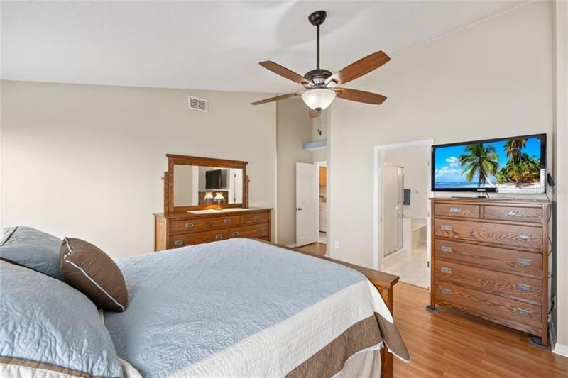 Master Bedroom features Vaulted Ceilings and Laminate Floors.