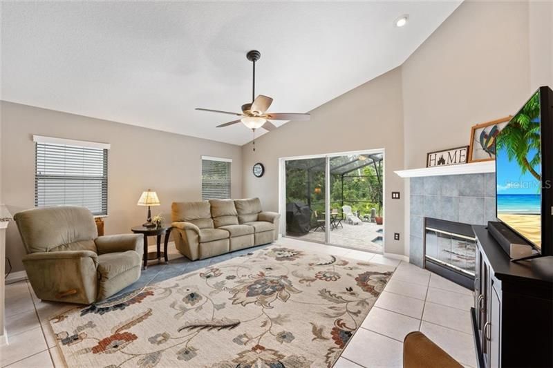 Family Room Highlights include a Wood Burning Fireplace with Mantle and Vaulted Ceilings.