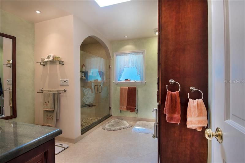 Large newly remodeled Master En suite featuring custom walk in shower, walk in closet and double vanity.