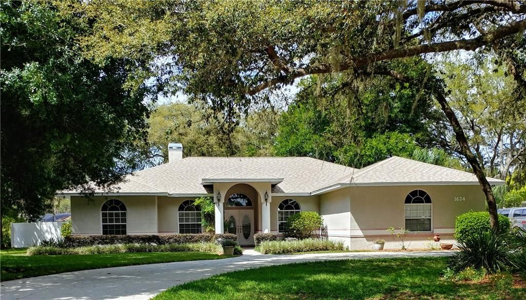 1634 Lady Bowers Trail. South facing front with circle drive and side facing garage.