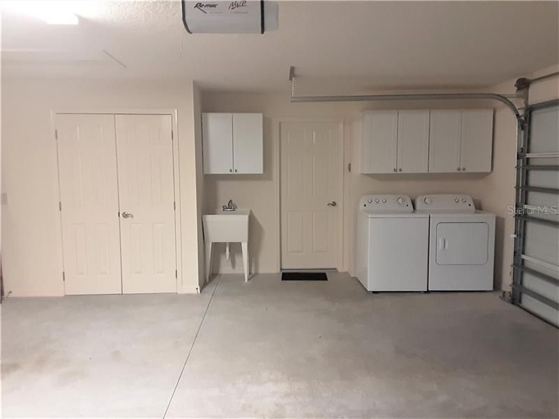 LARGE garage with inside Laundry and storage.