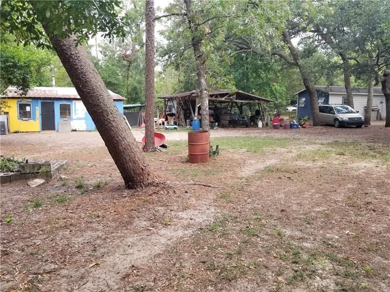 2/1 home at right, storage buildings at center and left. Plenty of room for all of your toys.