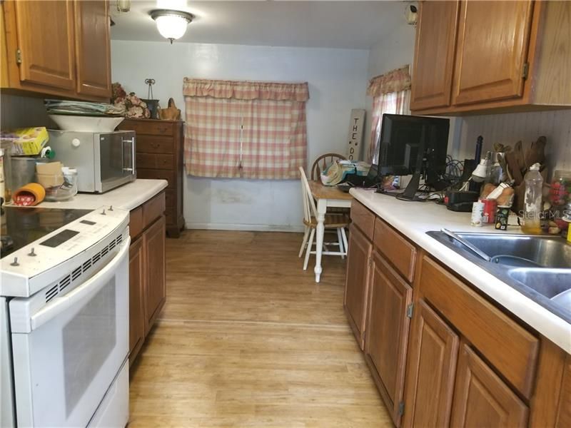 Kitchen towards dining area. Appliances stay with your new home.