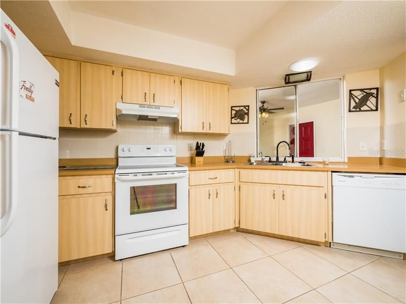 LARGE EAT-IN KITCHEN WITH NEW TILE FLOOR.
