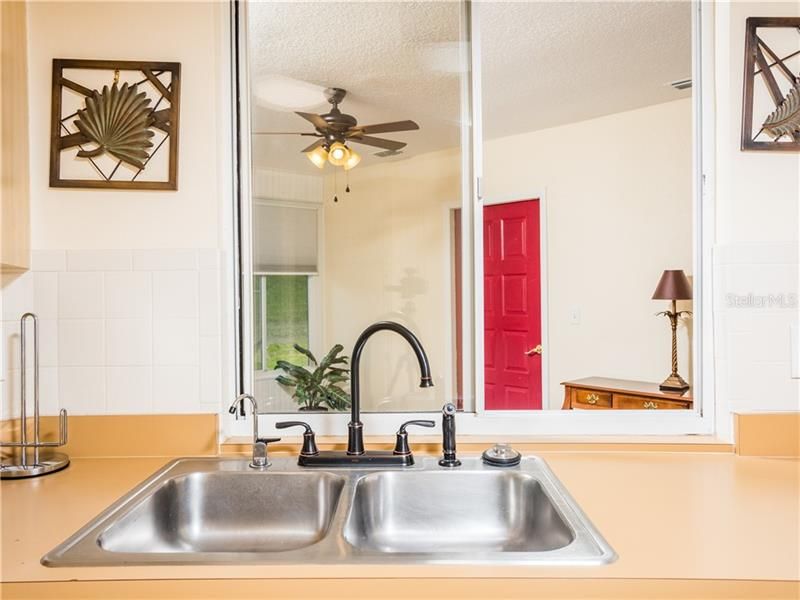 DOUBLE SINK WITH PASS THRU TO THE FLORIDA ROOM.