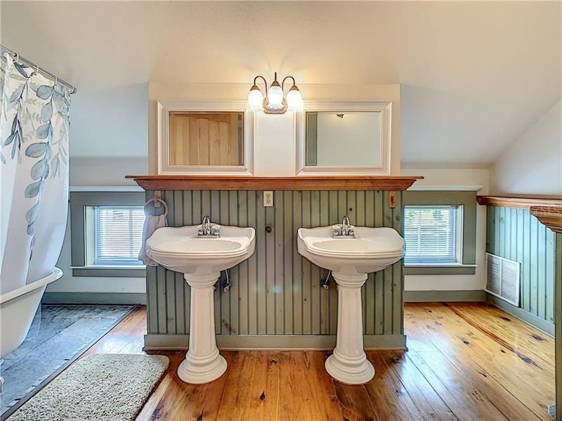 Bath with double sinks and claw foot tub/shower