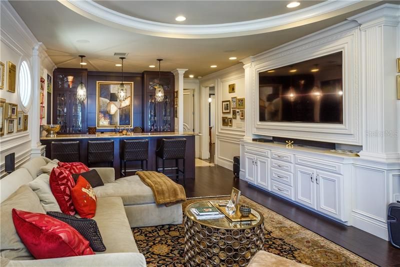 The Entertainment Room or Family room with luxury Bar - shown in the rear of the photo !