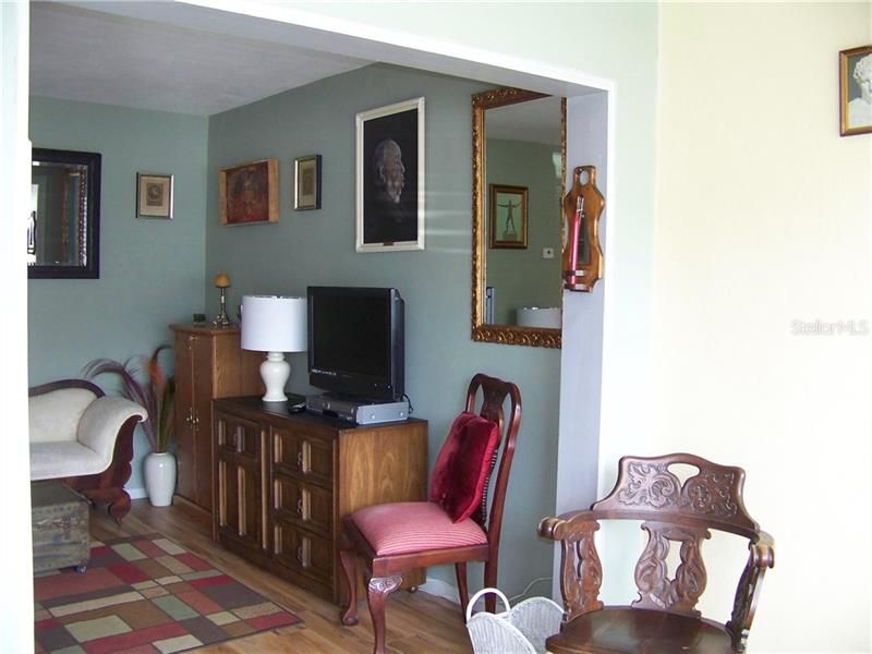 You're looking into the living room. Notice the beautiful, easy maintenance flooring!