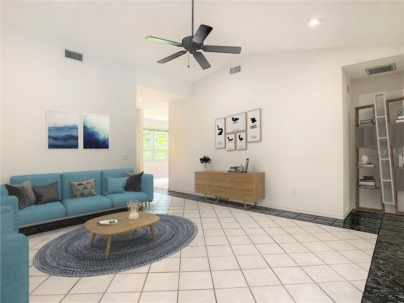 Expansive great room with volume ceilings and double door entry to the large Florida room.
