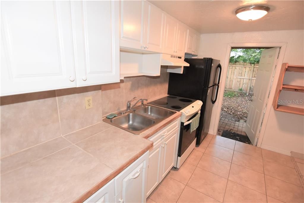 Kitchen in 2 bedroom with view to outside access