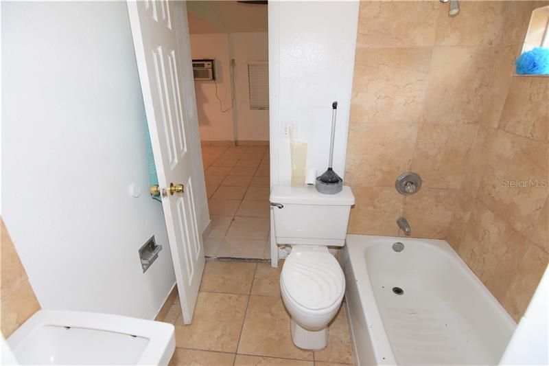 Full bath to 2 bedroom apartment.