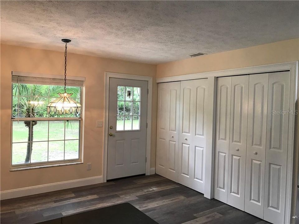 Dining nook with pantry and Laundry room doors