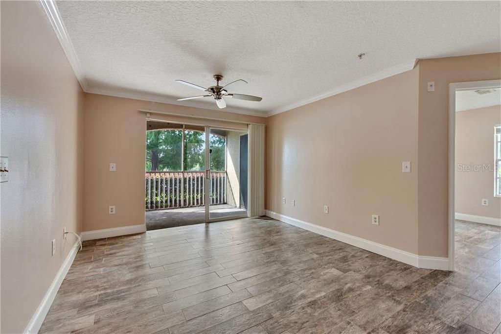 Great room leading to screen patio with peaceful water view.