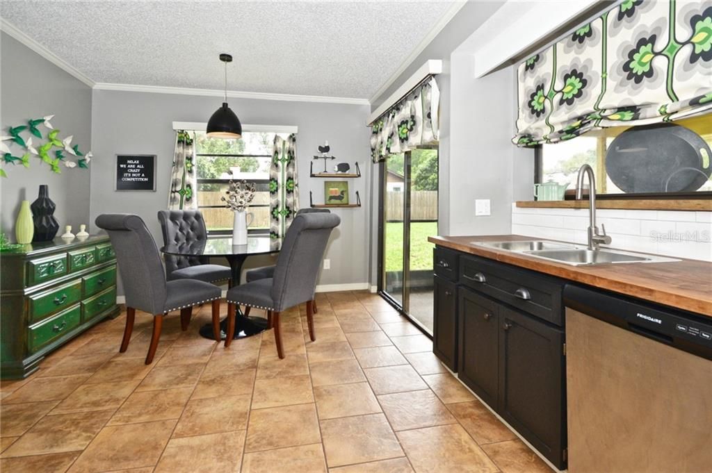 Crown molding, tile flooring, sliding glass doors and tons of light!