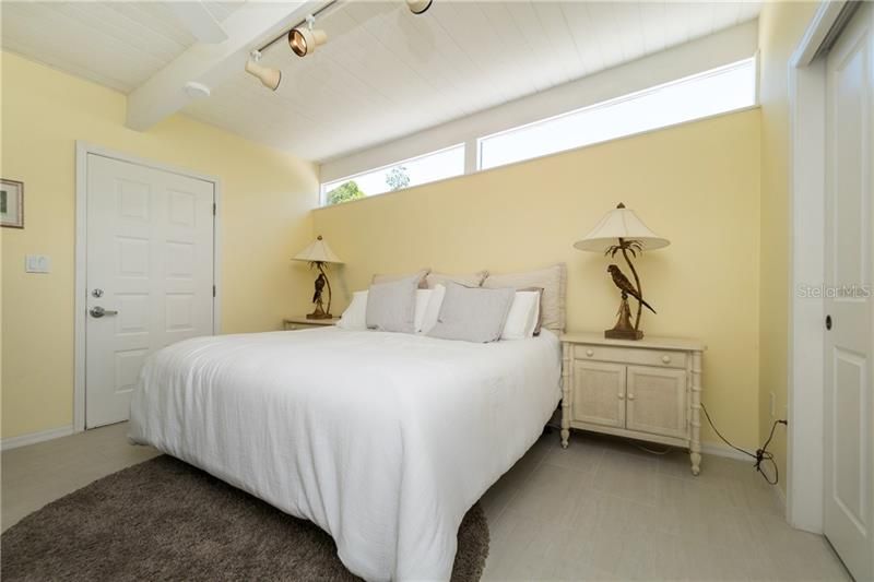 Bedroom #2 has beautiful tropical flair and an en suite bathroom.