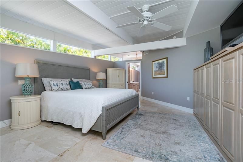 Master bedroom features built in cabinetry.
