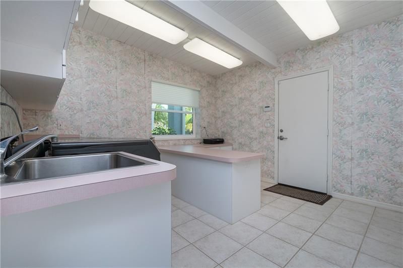 Huge utility room with lots of built ins provide all the storage space you need!