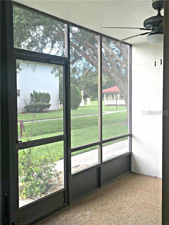 Screened porch with ceiling fan