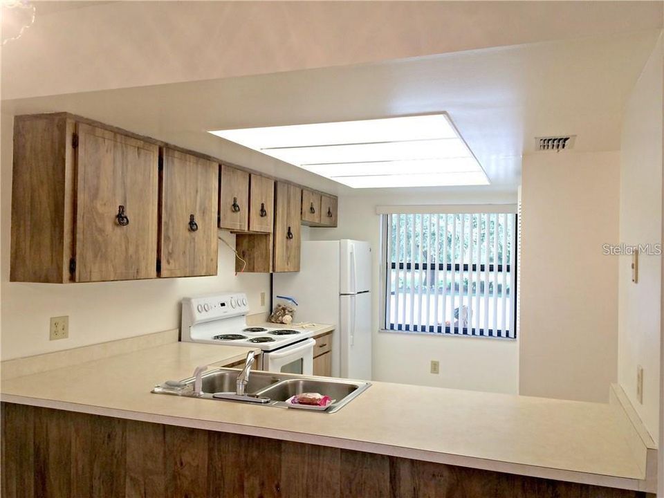 Kitchen with ample cabinet space and closet pantry