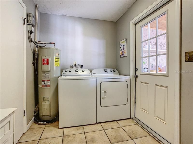 ~ Different View Laundry Room is Huge and Doubles as a Mud Room - Plenty of Organized Storage.  Nice and Bright (Washer / Dryer Do NOT Convey)