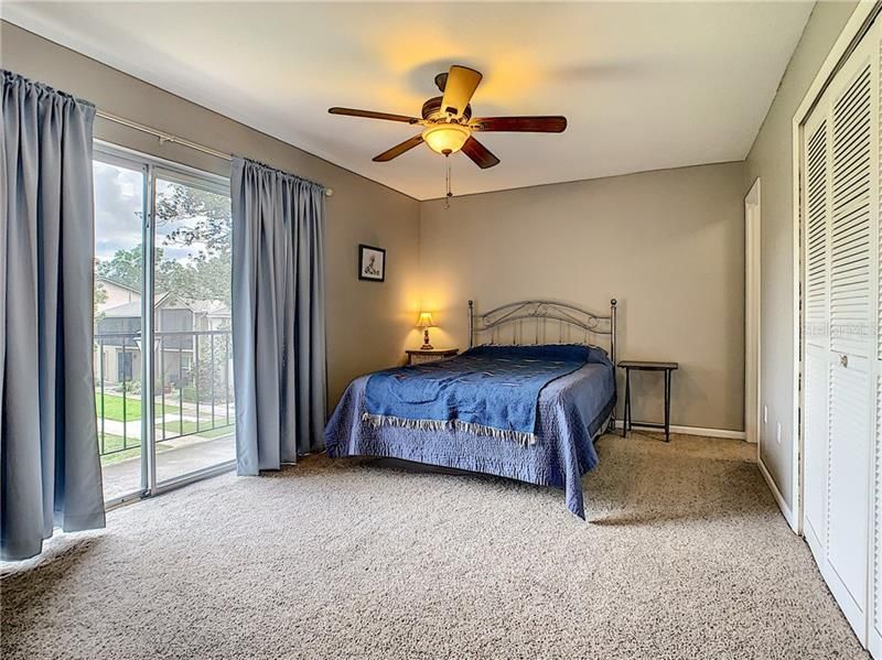 Master Bedroom - Bright and Spacious, Balcony Overlooks the Lush Courtyard