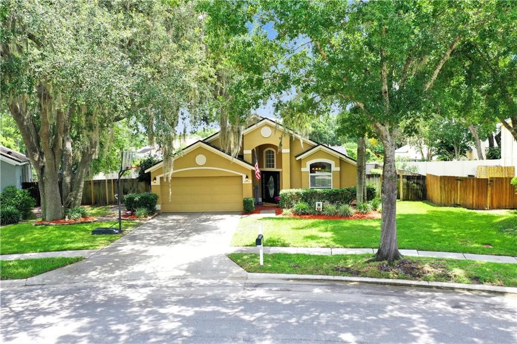 Gorgeous Oaks surround this Beautifully Maintained home.