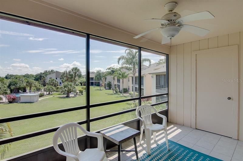 Covered lanai overlooking community pool and golf course. Extra closet storage space on Lanai
