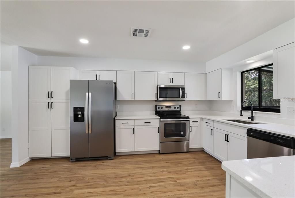 New Cabinets, Stainless Appliances, and Quartz Countertops